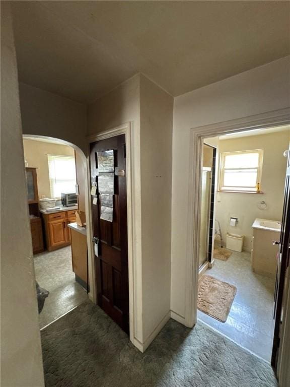 2709 Leland St, Perry Hilltop, PA 15214 - hallway featuring arched walkways and healthy amount of natural light