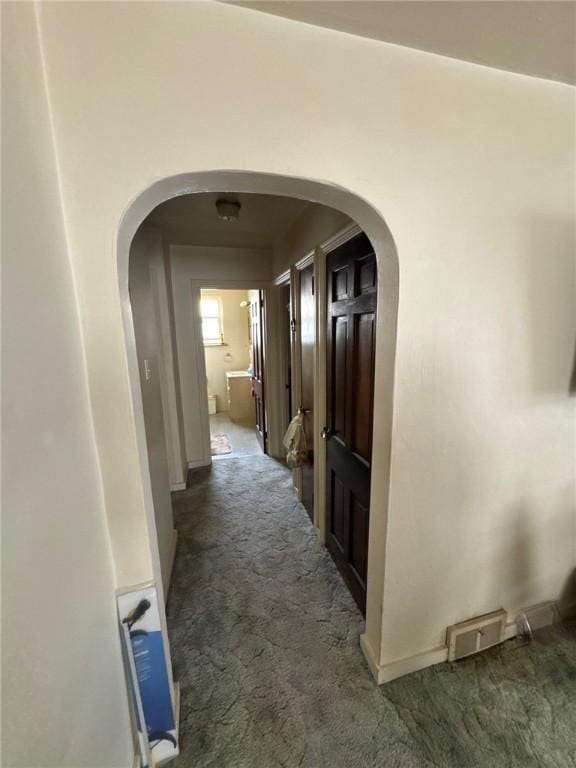 2709 Leland St, Perry Hilltop, PA 15214 - hallway with carpet flooring, arched walkways, and baseboards