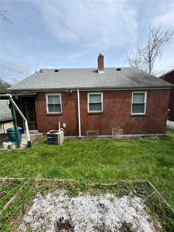2709 Leland St, Perry Hilltop, PA 15214 - rear view of property with a chimney, a shingled roof, and brick siding