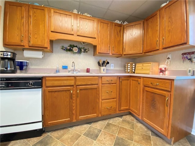 3 Kilbourne Rd, West Salem Twp, PA 16125 - kitchen with dishwasher, a sink, a drop ceiling, light countertops, and brown cabinets