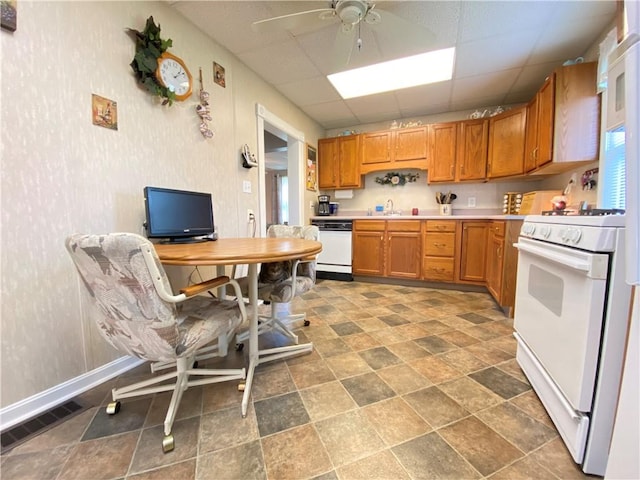 3 Kilbourne Rd, West Salem Twp, PA 16125 - kitchen featuring white appliances, a ceiling fan, baseboards, light countertops, and a sink