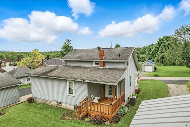 3 Kilbourne Rd, West Salem Twp, PA 16125 - back of house with roof with shingles, central AC unit, an outbuilding, a wooden deck, and a yard