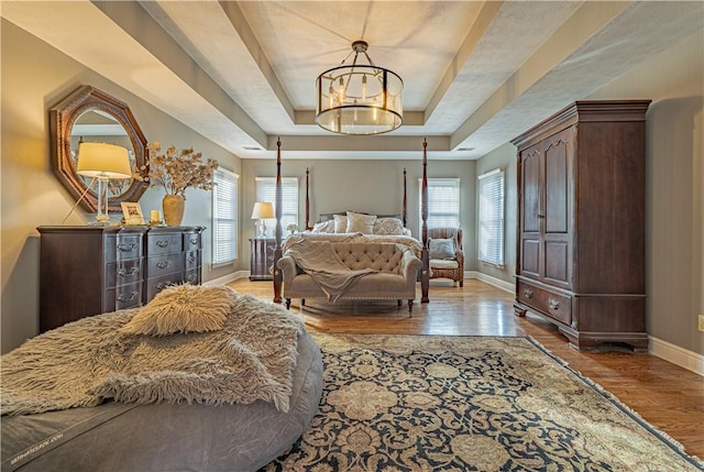 102 Maple Gln, Peters Twp, PA 15367 - bedroom with a tray ceiling, wood finished floors, baseboards, and multiple windows