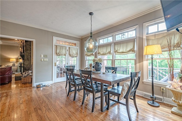 102 Maple Gln, Peters Twp, PA 15367 - dining area with crown molding, baseboards, and wood finished floors