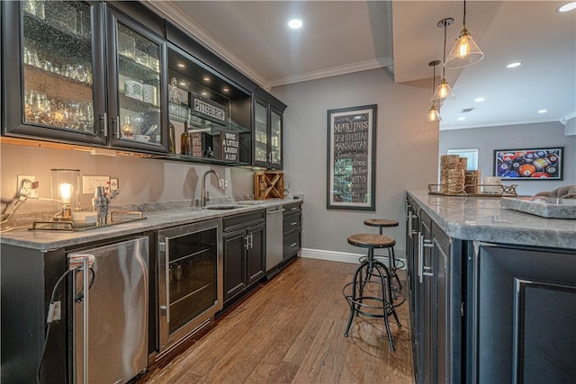 102 Maple Gln, Peters Twp, PA 15367 - indoor wet bar featuring wine cooler, dishwasher, ornamental molding, dark wood-style floors, and hanging light fixtures