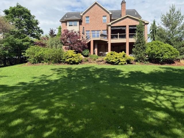 102 Maple Gln, Peters Twp, PA 15367 - rear view of house with a lawn and a chimney