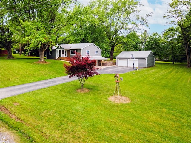 321 Green Acres Ln, Shenango Twp Law, PA 16101 - view of front of home with an outbuilding, a detached garage, a front lawn, and view of scattered trees
