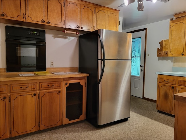 118 Wide View Ter, Unity Twp, PA 15650 - kitchen with oven, freestanding refrigerator, and brown cabinets