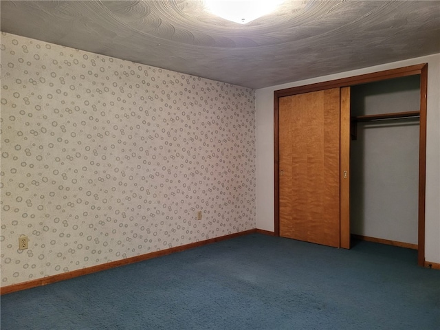 118 Wide View Ter, Unity Twp, PA 15650 - unfurnished bedroom with carpet flooring, a closet, baseboards, and wallpapered walls