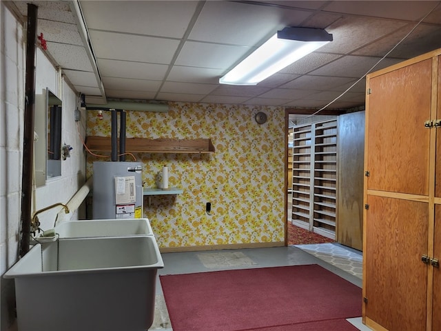 118 Wide View Ter, Unity Twp, PA 15650 - kitchen featuring water heater, a drop ceiling, a sink, concrete flooring, and baseboards