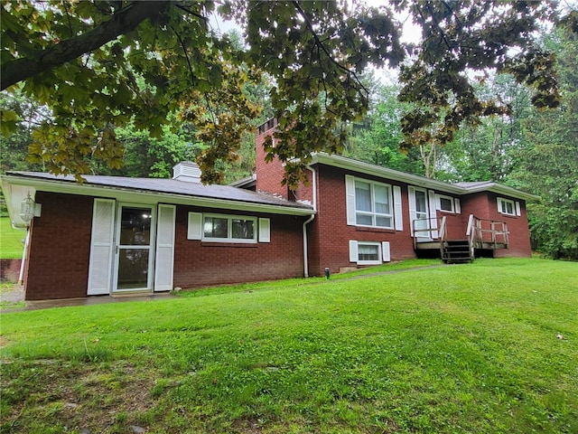 118 Wide View Ter, Unity Twp, PA 15650 - view of front of property featuring brick siding, a chimney, and a front lawn