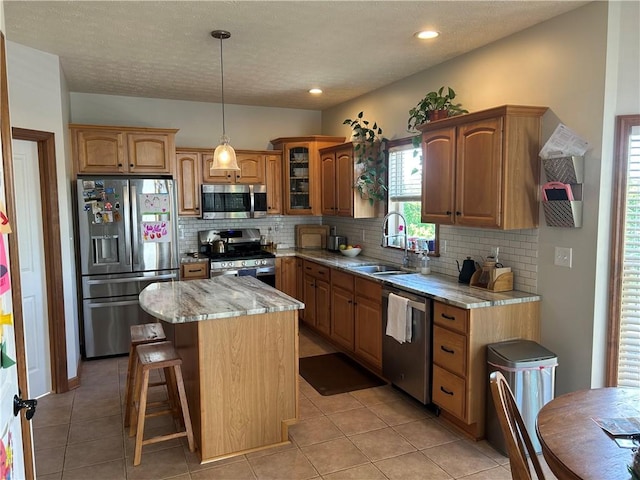 1016 Noble Pine Ct, Penn Twp Wml, PA 15085 - kitchen featuring stainless steel appliances, a sink, light stone counters, tasteful backsplash, and recessed lighting