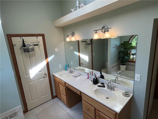 1016 Noble Pine Ct, Penn Twp Wml, PA 15085 - bathroom with toilet, tile patterned flooring, double vanity, and a tub to relax in
