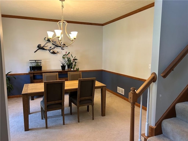 1016 Noble Pine Ct, Penn Twp Wml, PA 15085 - dining area with a chandelier, light carpet, ornamental molding, stairway, and baseboards