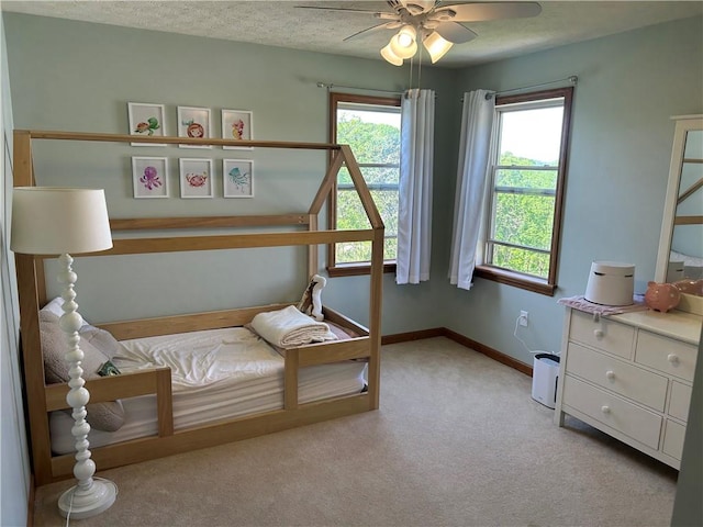 1016 Noble Pine Ct, Penn Twp Wml, PA 15085 - bedroom with light colored carpet, multiple windows, baseboards, and a ceiling fan