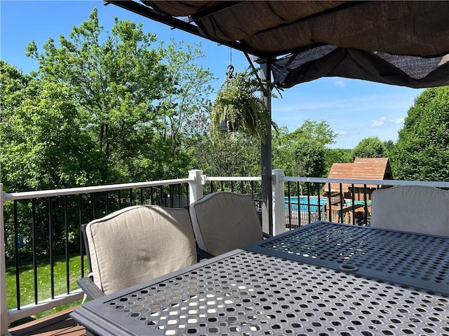 1016 Noble Pine Ct, Penn Twp Wml, PA 15085 - wooden deck with outdoor dining area and an outdoor pool