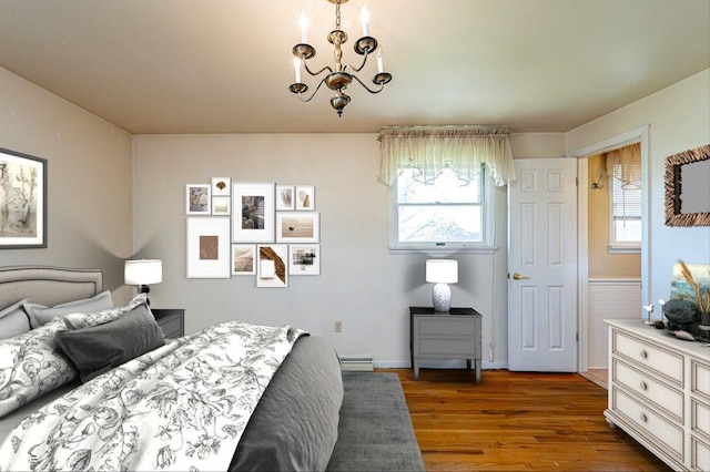 118 Cortland Dr, Hempfield Twp Wml, PA 15672 - bedroom featuring wood finished floors, a chandelier, and a baseboard heating unit