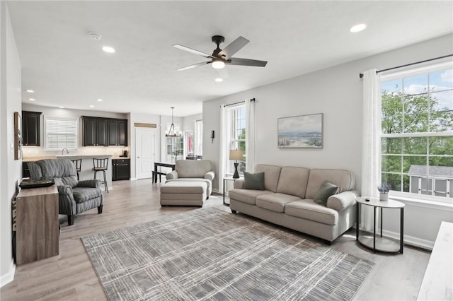 215 Old Hickory Rd, Jackson Twp But, PA 16063 - living room featuring light wood-style flooring, a ceiling fan, recessed lighting, a chandelier, and baseboards
