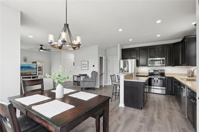 215 Old Hickory Rd, Jackson Twp But, PA 16063 - dining area with a chandelier, a ceiling fan, recessed lighting, and light wood-style floors