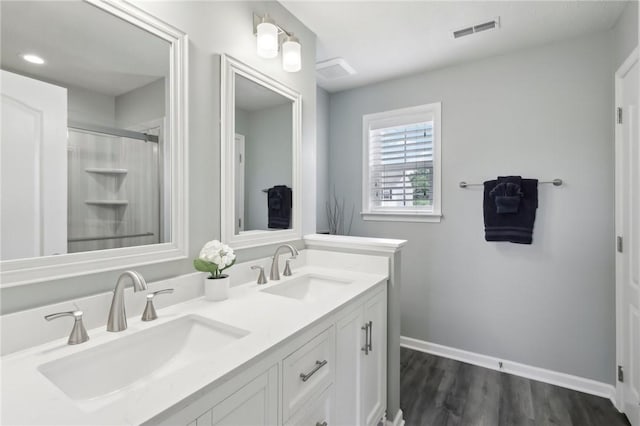 215 Old Hickory Rd, Jackson Twp But, PA 16063 - full bath featuring baseboards, wood finished floors, double vanity, an enclosed shower, and recessed lighting