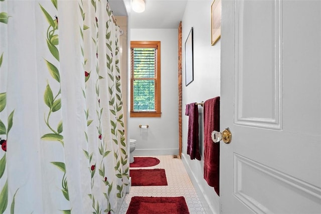 534 Trenton Ave, Regent Square, PA 15221 - full bathroom with toilet, tile patterned flooring, baseboards, and a shower with shower curtain