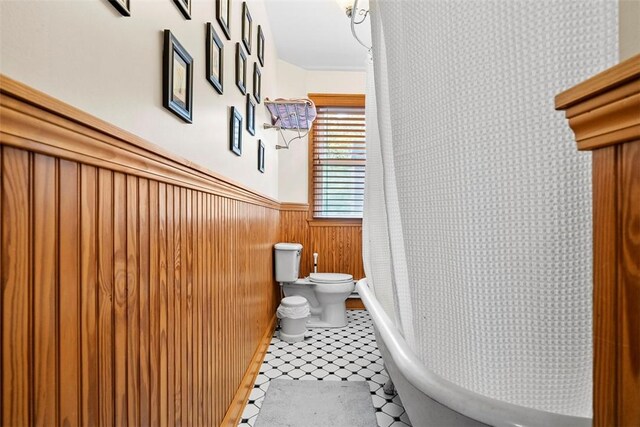 534 Trenton Ave, Regent Square, PA 15221 - bathroom with toilet, a wainscoted wall, a tub to relax in, and a shower with shower curtain