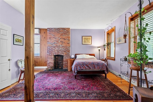 534 Trenton Ave, Regent Square, PA 15221 - bedroom with wood finished floors, a wall mounted air conditioner, and baseboards