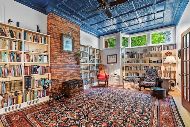 534 Trenton Ave, Regent Square, PA 15221 - living area featuring ceiling fan, an ornate ceiling, wood finished floors, and bookshelves