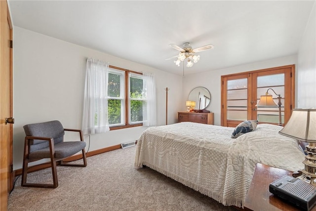 1068 Lakeview Dr, Unity Twp, PA 15650 - bedroom with french doors, carpet, baseboards, and ceiling fan