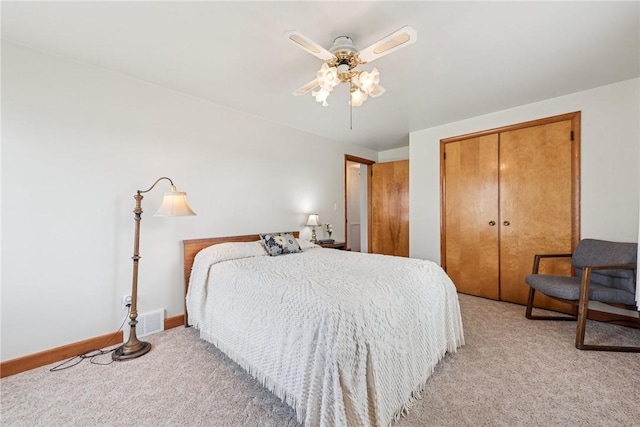 1068 Lakeview Dr, Unity Twp, PA 15650 - bedroom featuring light carpet, a closet, baseboards, and a ceiling fan