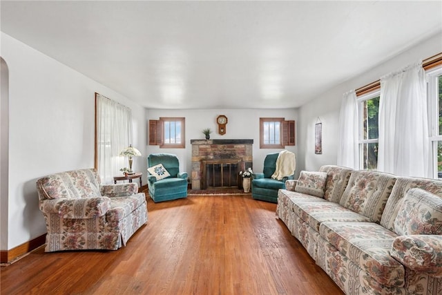 1068 Lakeview Dr, Unity Twp, PA 15650 - living room with healthy amount of natural light, wood finished floors, and arched walkways