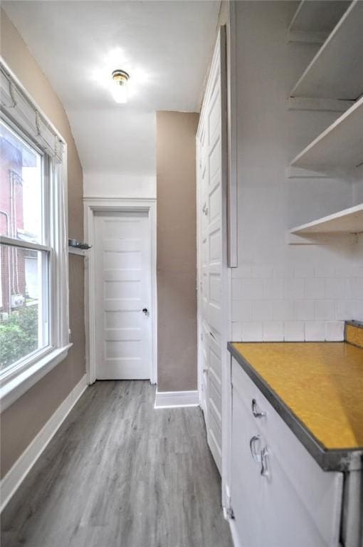 222 Orchard Ave, Canonsburg, PA 15317 - bar area featuring wood finished floors, baseboards, and backsplash