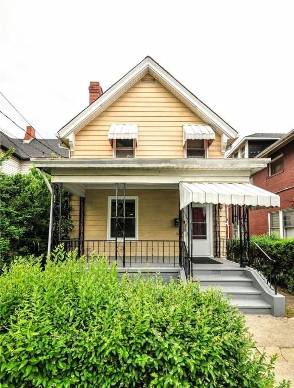 222 Orchard Ave, Canonsburg, PA 15317 - rear view of house featuring a chimney and a porch