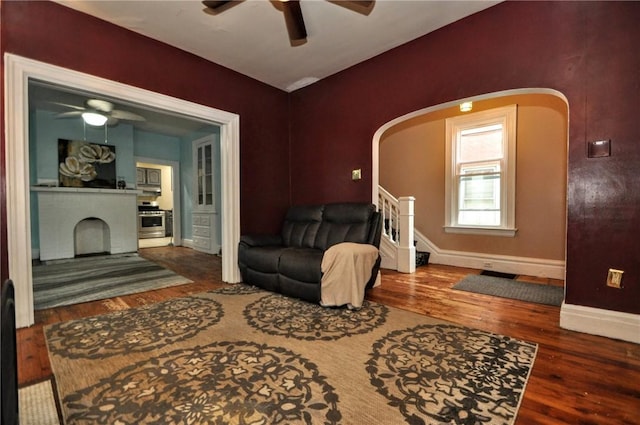 222 Orchard Ave, Canonsburg, PA 15317 - living room with a ceiling fan, arched walkways, wood finished floors, and baseboards