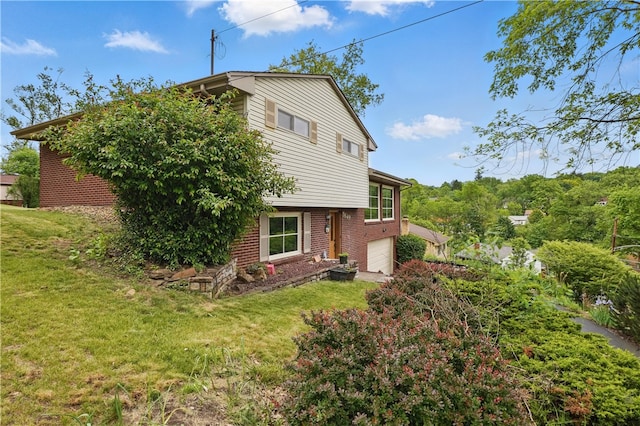 5849 Wilson Dr, Bethel Park, PA 15102 - view of property exterior with a garage, brick siding, and a lawn