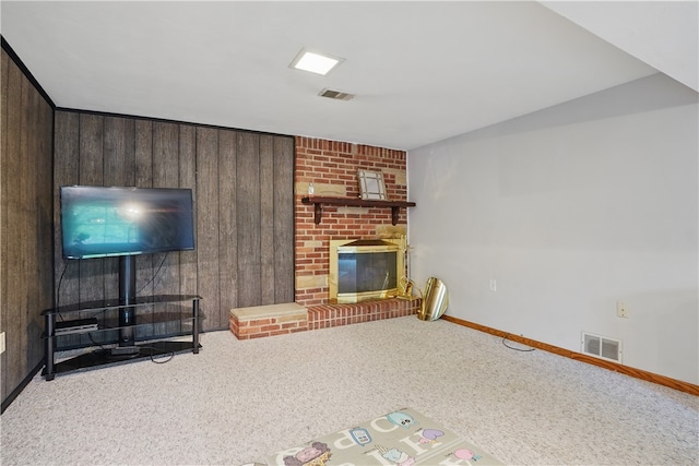 5849 Wilson Dr, Bethel Park, PA 15102 - unfurnished living room featuring carpet floors, a fireplace, baseboards, and wood walls
