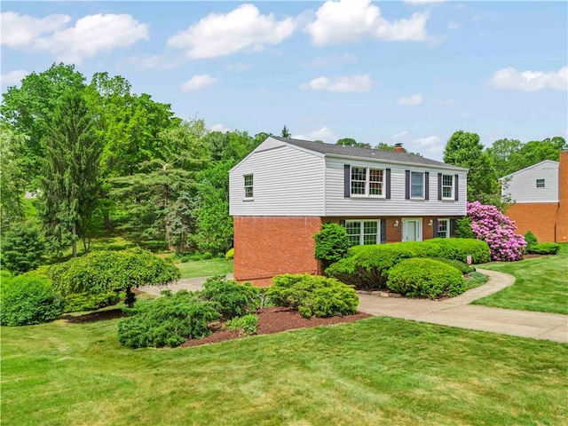 187 Friar Ln, Peters Twp, PA 15317 - view of front of property with brick siding, a front yard, and a chimney