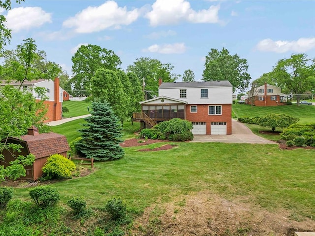 187 Friar Ln, Peters Twp, PA 15317 - back of property with an attached garage, stairway, a yard, and brick siding