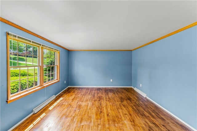 187 Friar Ln, Peters Twp, PA 15317 - unfurnished room with baseboard heating, crown molding, hardwood / wood-style floors, and baseboards