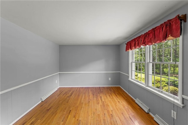187 Friar Ln, Peters Twp, PA 15317 - unfurnished room with baseboard heating, light wood-style floors, and a baseboard radiator