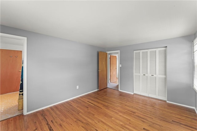 187 Friar Ln, Peters Twp, PA 15317 - unfurnished bedroom with wood finished floors, a closet, and baseboards