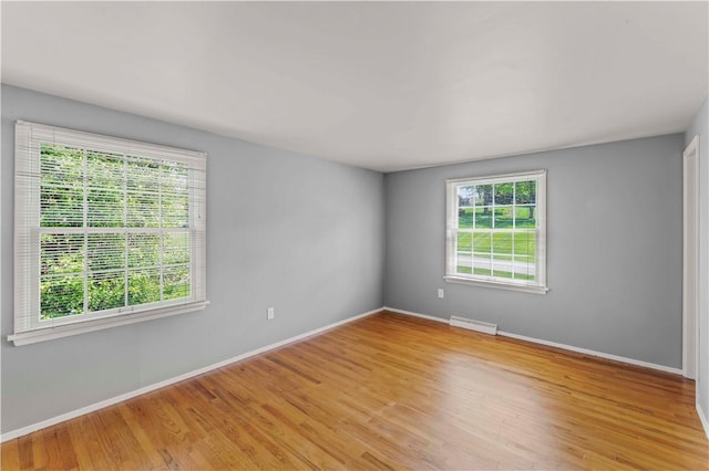 187 Friar Ln, Peters Twp, PA 15317 - empty room featuring plenty of natural light, baseboards, and light wood-type flooring