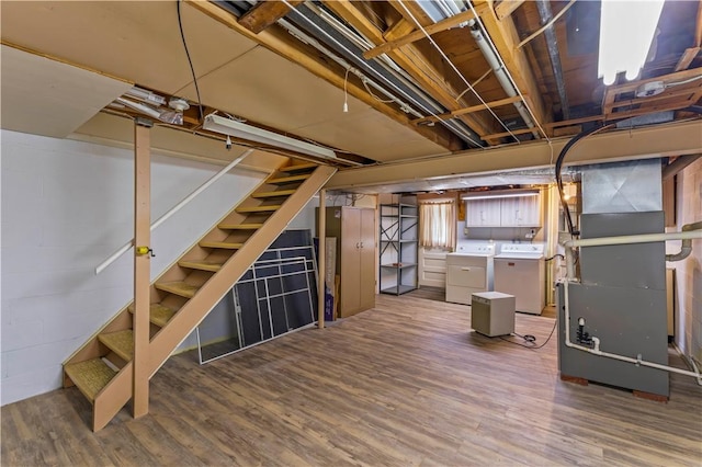 187 Friar Ln, Peters Twp, PA 15317 - unfinished below grade area with independent washer and dryer, heating unit, stairway, and wood finished floors