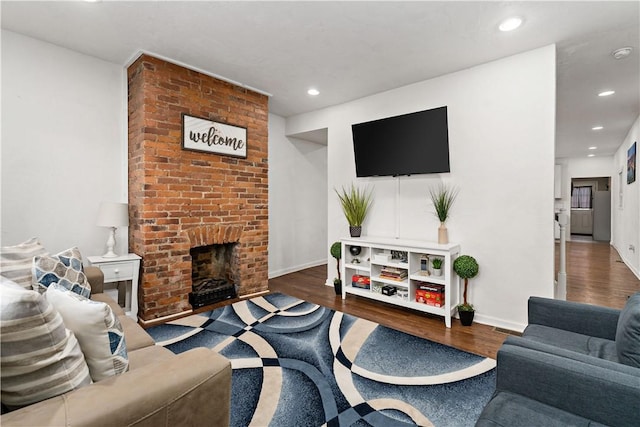 239 Albert St, Mt Washington, PA 15211 - living room with wood finished floors, recessed lighting, a brick fireplace, and baseboards