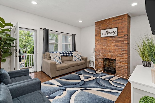 239 Albert St, Mt Washington, PA 15211 - living area featuring recessed lighting, wood finished floors, and a brick fireplace
