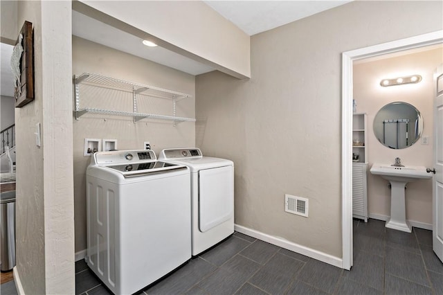 239 Albert St, Mt Washington, PA 15211 - laundry room featuring independent washer and dryer, baseboards, and dark tile patterned flooring