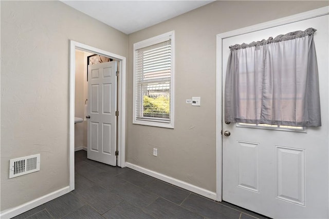 239 Albert St, Mt Washington, PA 15211 - entrance foyer featuring baseboards and dark tile patterned floors