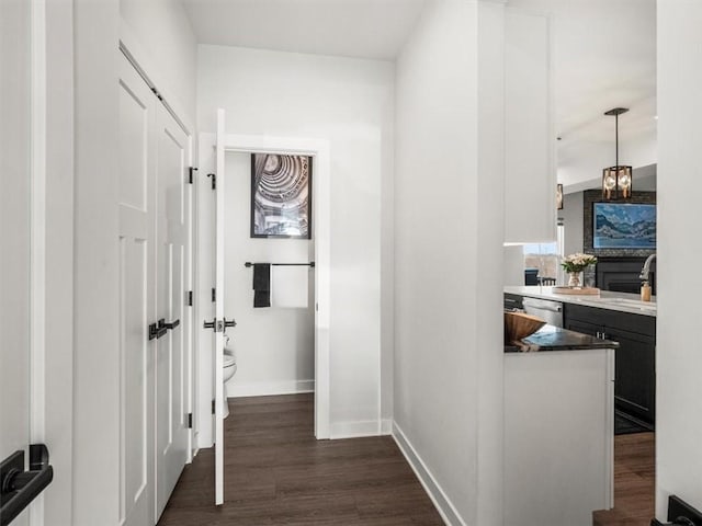 127 Red Horse Dr, Buffalo Twp, PA 16055 - corridor with baseboards, dark wood-style floors, and a sink