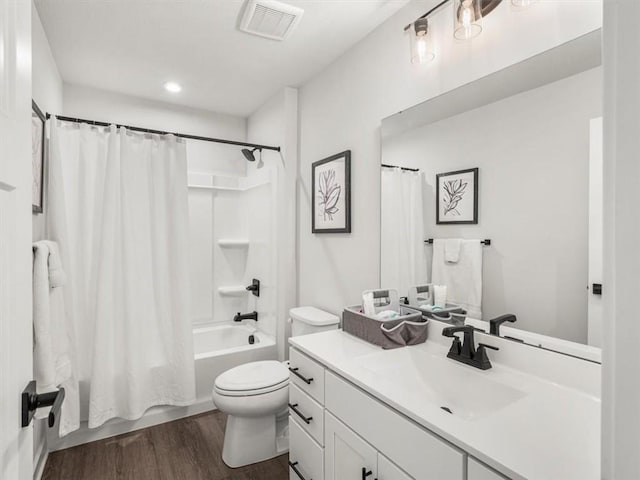 127 Red Horse Dr, Buffalo Twp, PA 16055 - bathroom with wood finished floors, shower / tub combo with curtain, toilet, and vanity
