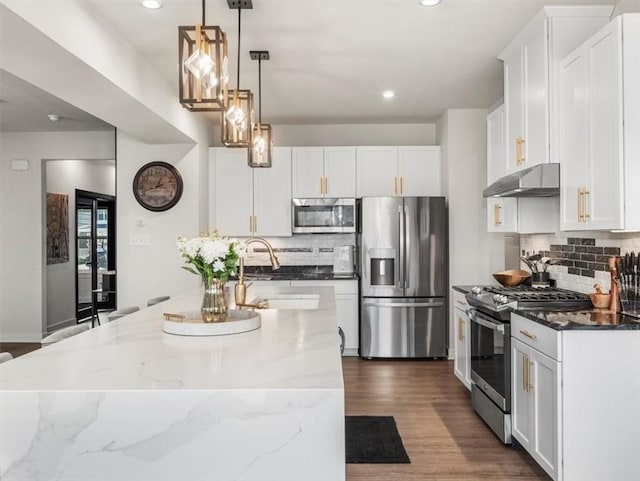 127 Red Horse Dr, Buffalo Twp, PA 16055 - kitchen featuring stainless steel appliances, under cabinet range hood, tasteful backsplash, white cabinetry, and recessed lighting